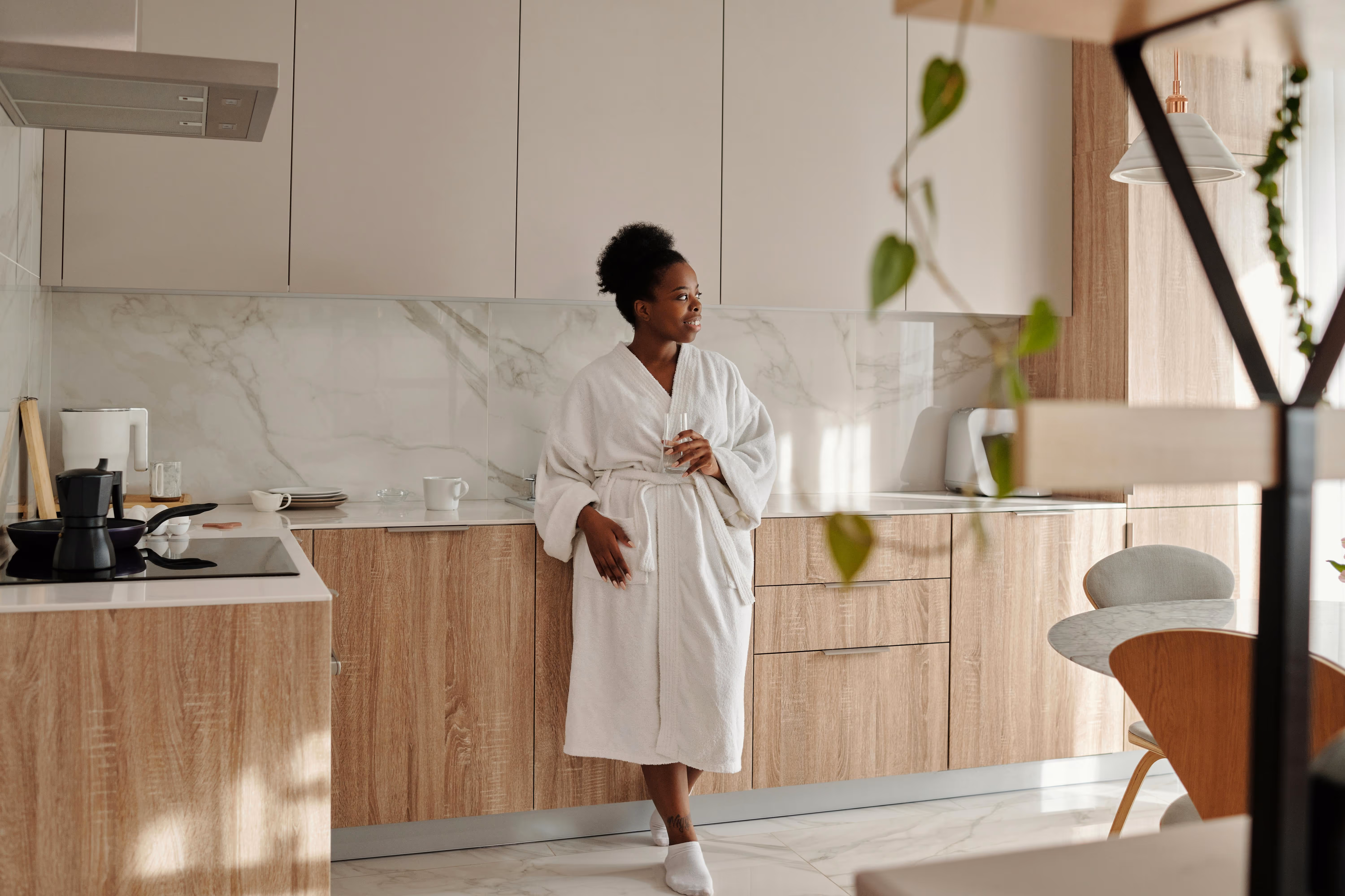 Woman enjoying her renovated kitchen
